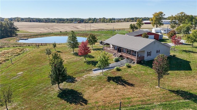 birds eye view of property with a rural view and a water view