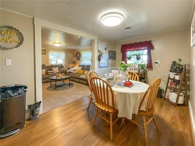 dining area with hardwood / wood-style floors