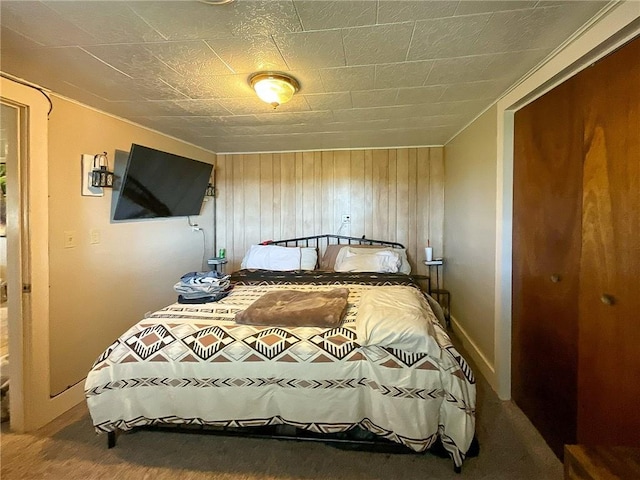 bedroom with wooden walls