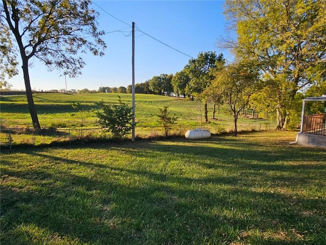 view of yard with a rural view