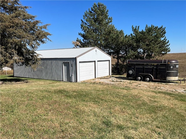 garage featuring a yard