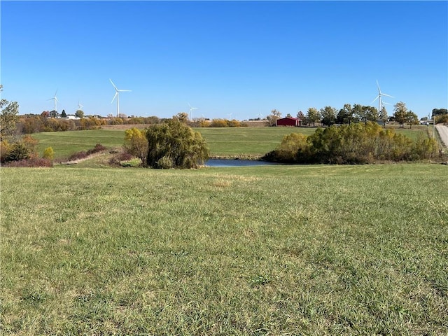 view of yard with a rural view