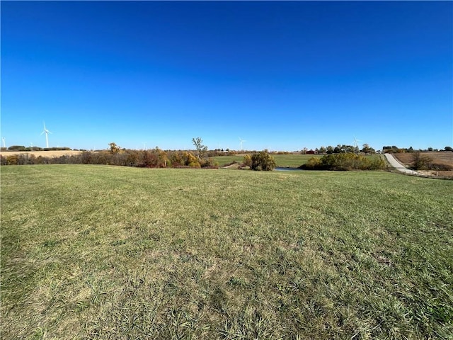 view of yard with a rural view