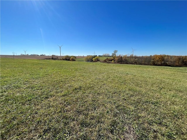 view of yard with a rural view