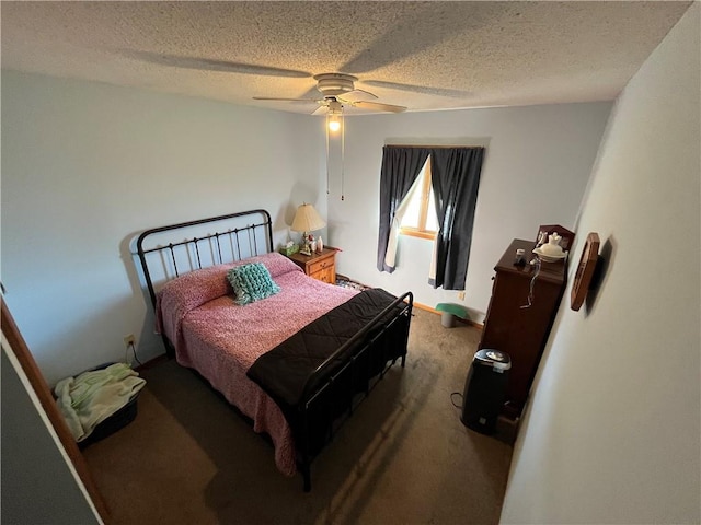 carpeted bedroom featuring a textured ceiling and ceiling fan