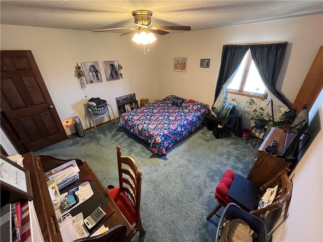 carpeted bedroom with a textured ceiling and ceiling fan