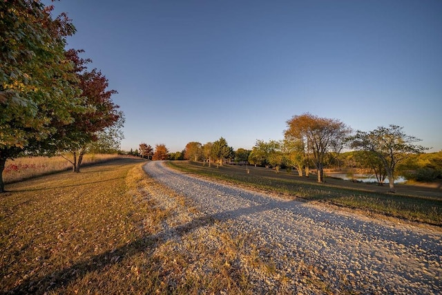 view of road with a water view and a rural view