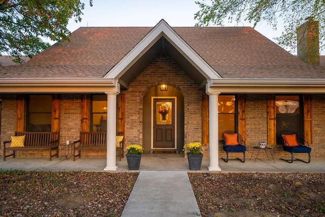 doorway to property with covered porch