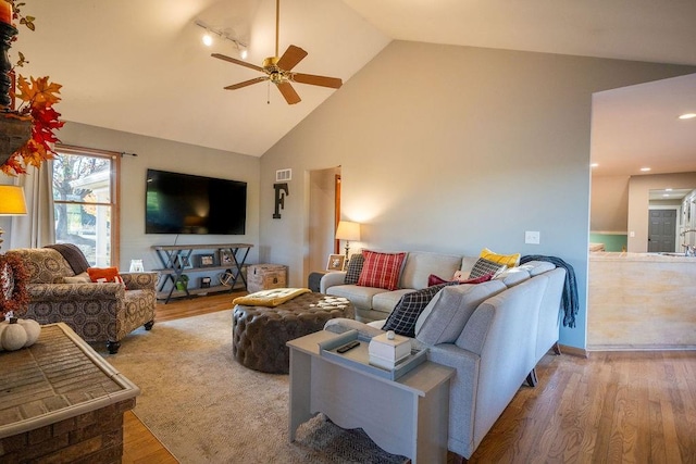 living room with sink, high vaulted ceiling, light wood-type flooring, and ceiling fan