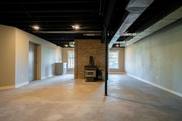 basement featuring a wood stove