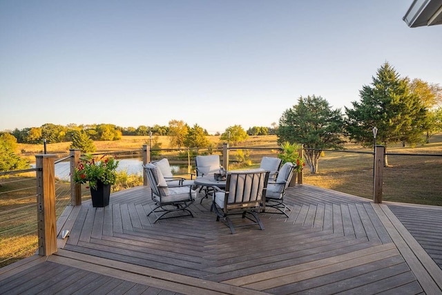 wooden terrace with a water view