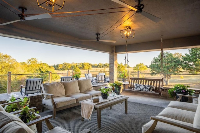 view of patio / terrace featuring ceiling fan, a rural view, and outdoor lounge area