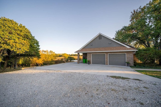 view of side of home with a garage