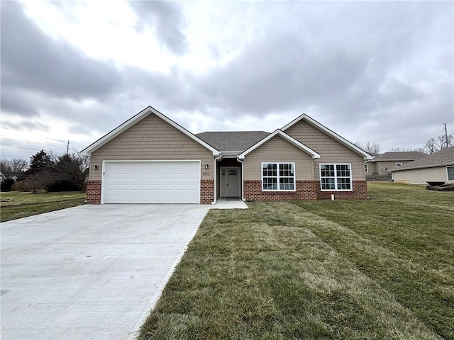 view of front of home with a garage and a front lawn