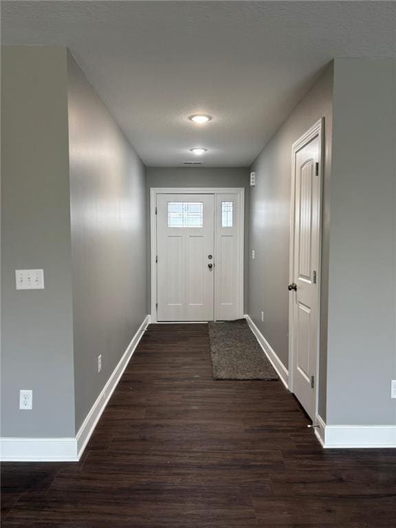 foyer with dark hardwood / wood-style flooring