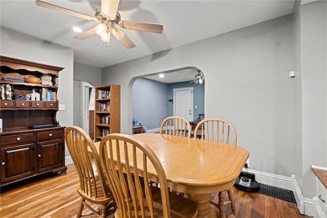 dining room featuring light wood-type flooring and ceiling fan