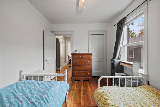 bedroom featuring dark hardwood / wood-style flooring and ceiling fan