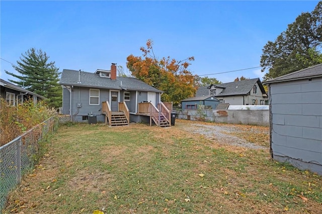 back of property featuring a yard