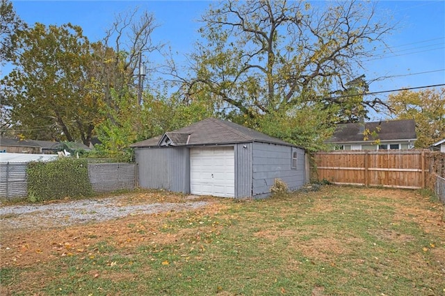 exterior space featuring a garage and an outdoor structure