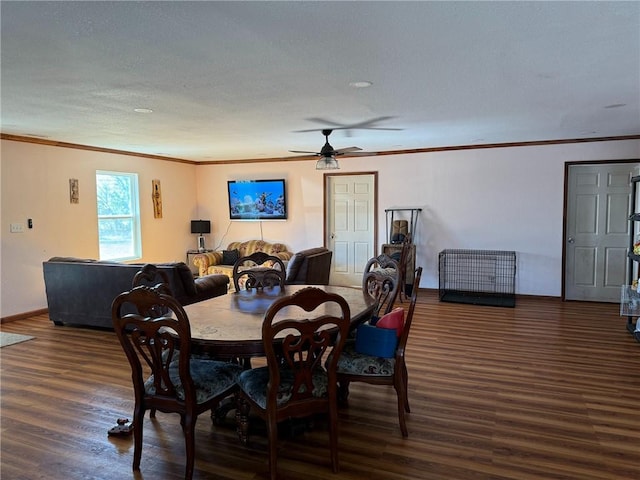 dining space with ceiling fan, crown molding, and dark hardwood / wood-style floors