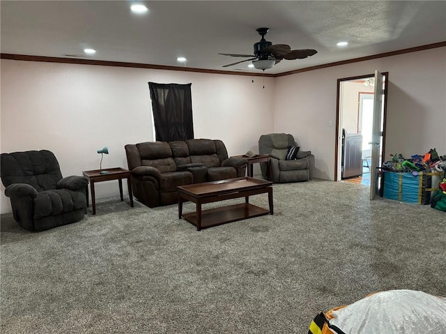 living room with ceiling fan, carpet, and crown molding