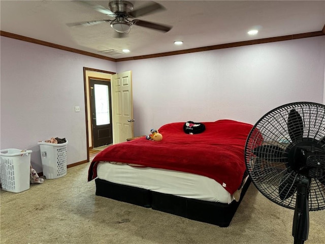 carpeted bedroom with ceiling fan and crown molding