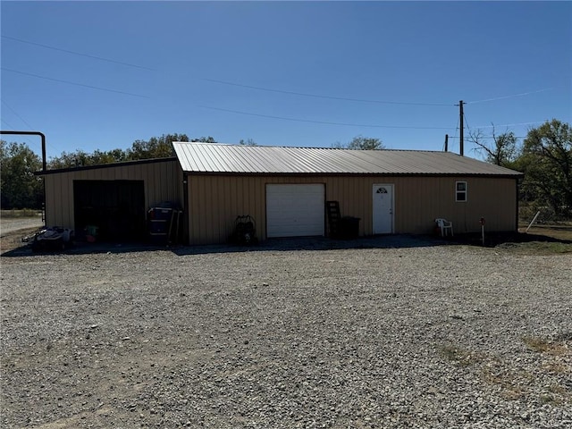 view of outbuilding with a garage