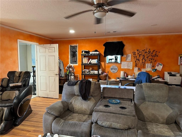 living room featuring a textured ceiling, ceiling fan, crown molding, and light hardwood / wood-style flooring