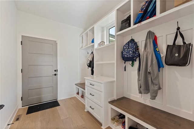 mudroom with light hardwood / wood-style floors