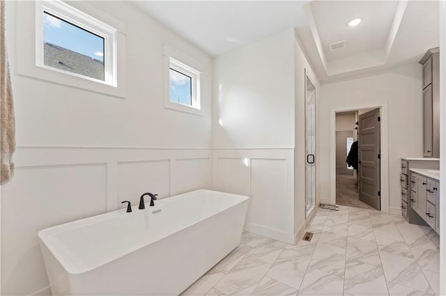 bathroom featuring vanity and separate shower and tub