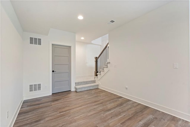 empty room with wood-type flooring