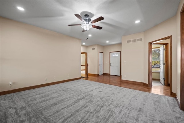 spare room with ceiling fan and hardwood / wood-style flooring