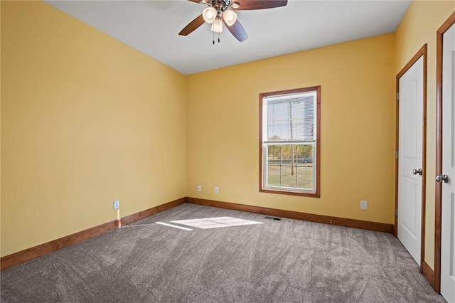 empty room featuring carpet and ceiling fan