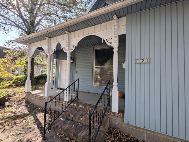 doorway to property featuring covered porch