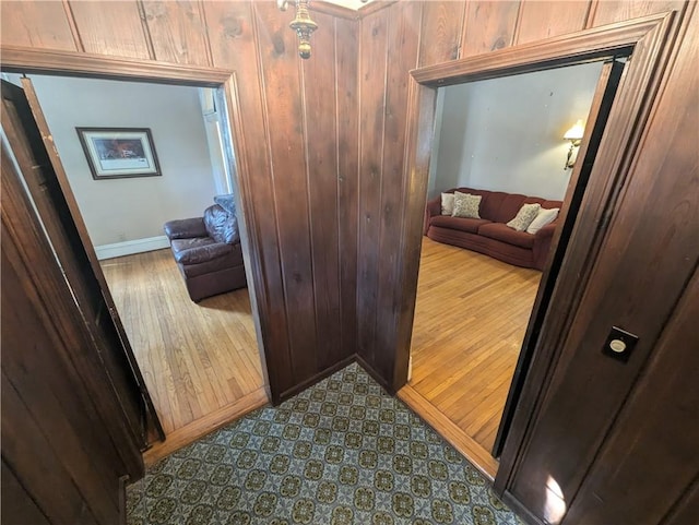 interior space with wooden walls and wood-type flooring