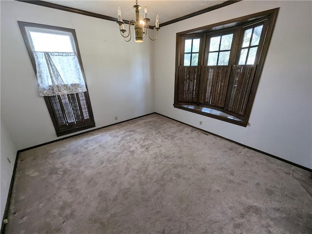 unfurnished room featuring an inviting chandelier, ornamental molding, plenty of natural light, and carpet floors