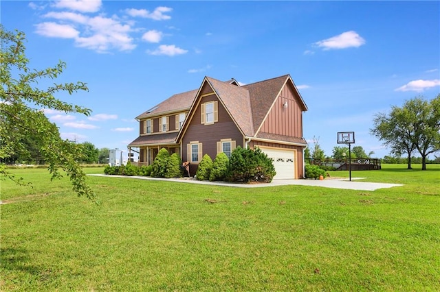 view of front of house with a front yard and a garage