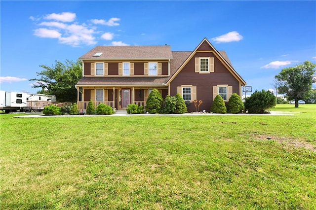 colonial inspired home with covered porch and a front lawn