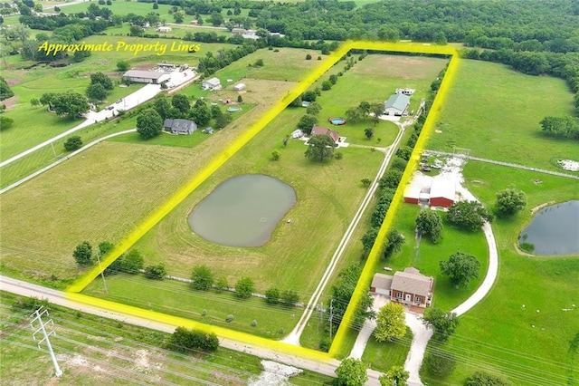 drone / aerial view featuring a water view and a rural view