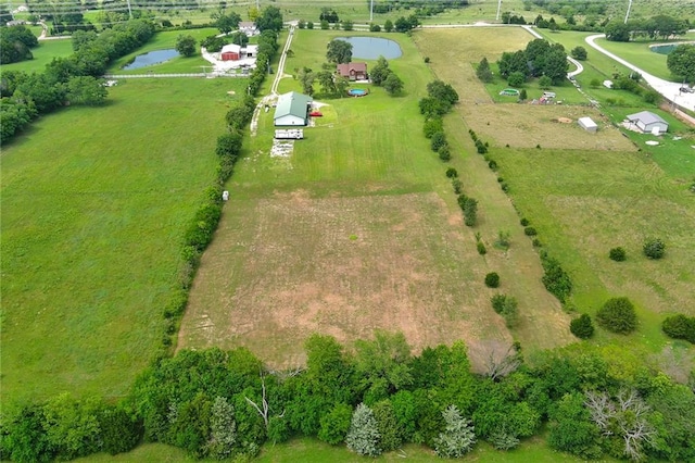 aerial view with a rural view and a water view