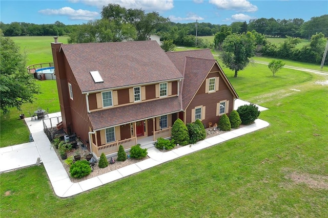 view of front of home featuring a front lawn and a porch