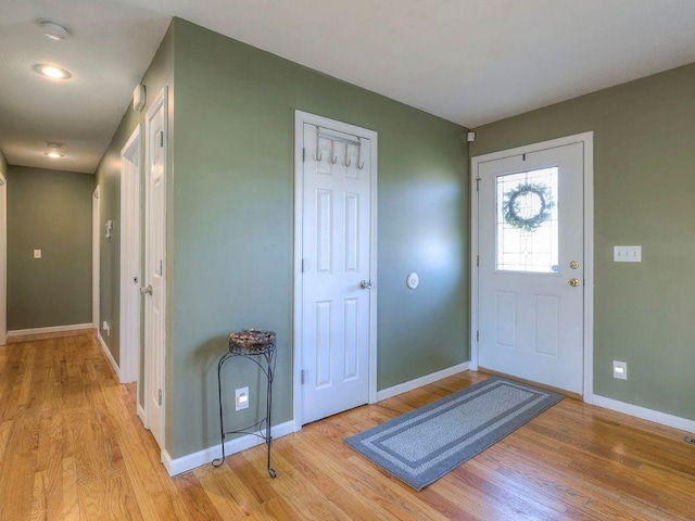 foyer entrance with light hardwood / wood-style floors