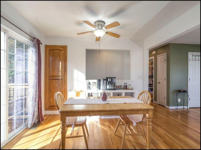 dining room featuring light hardwood / wood-style floors and ceiling fan