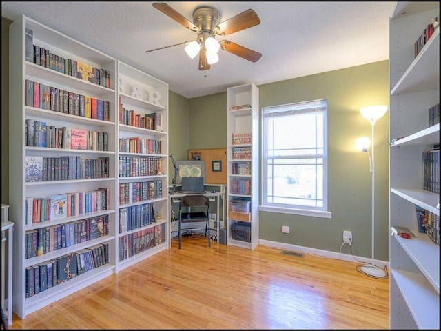 home office featuring ceiling fan and light wood-type flooring