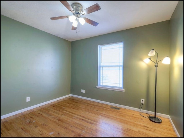 unfurnished room featuring light hardwood / wood-style floors and ceiling fan