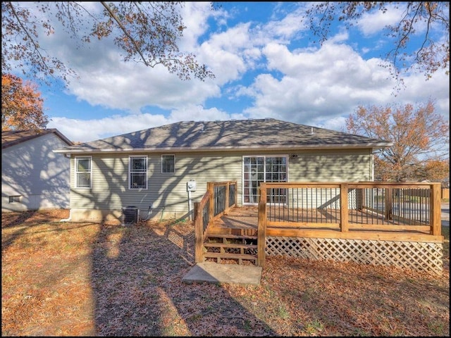 back of house featuring a wooden deck