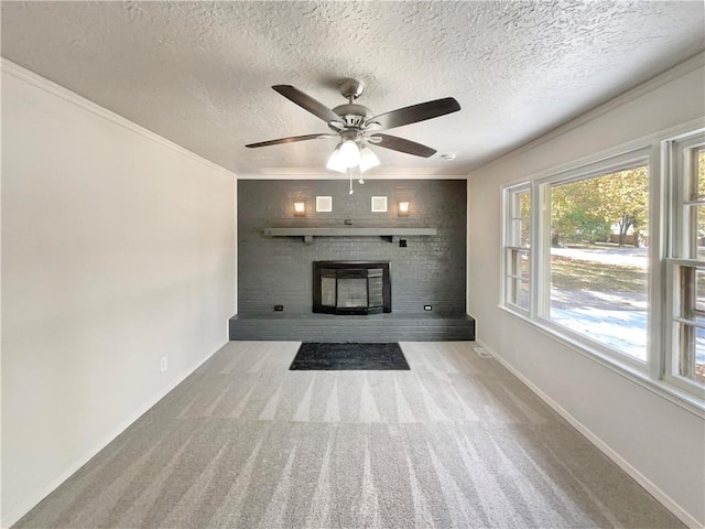 unfurnished living room with ceiling fan, a textured ceiling, and light colored carpet