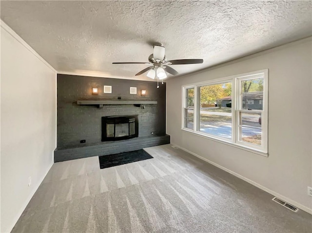 unfurnished living room featuring crown molding, light carpet, a textured ceiling, and ceiling fan