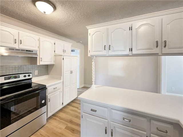 kitchen featuring decorative backsplash, electric range, white cabinetry, a textured ceiling, and light wood-type flooring