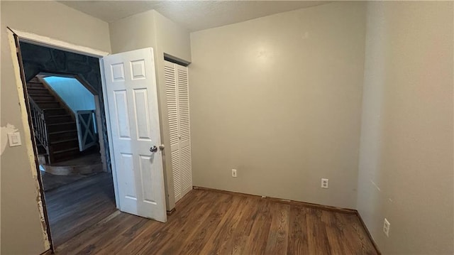 interior space with dark wood-type flooring